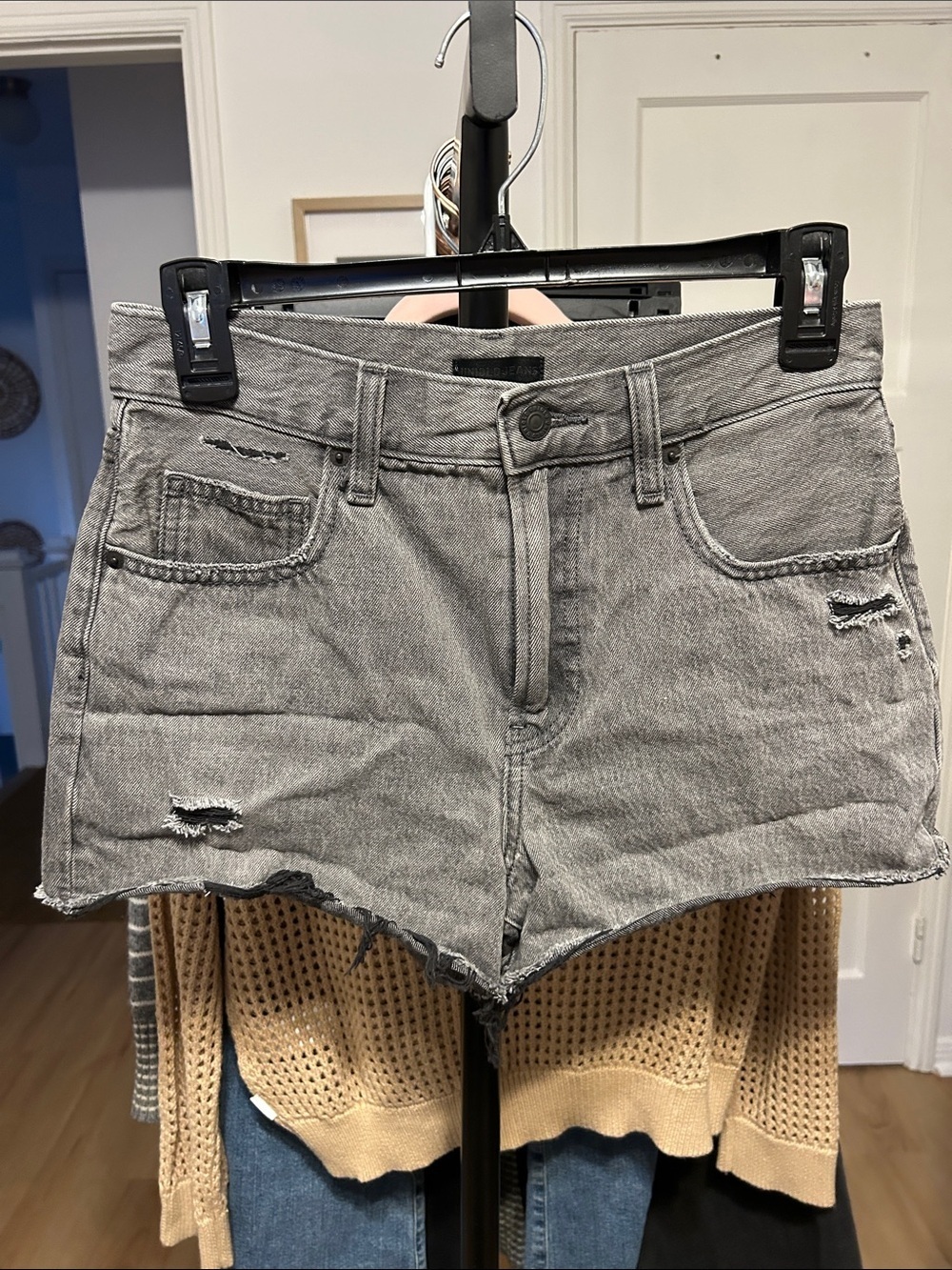 Uniqlo Black/Gray Distressed Jean Short. 23” waist, 3” inseam. Raw hem.
